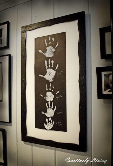 Descending Family Handprints in a Framed Wall Hanging