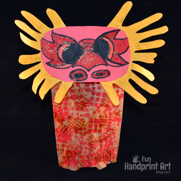 Paper Bag Chinese Dragon Puppet made with Handprints