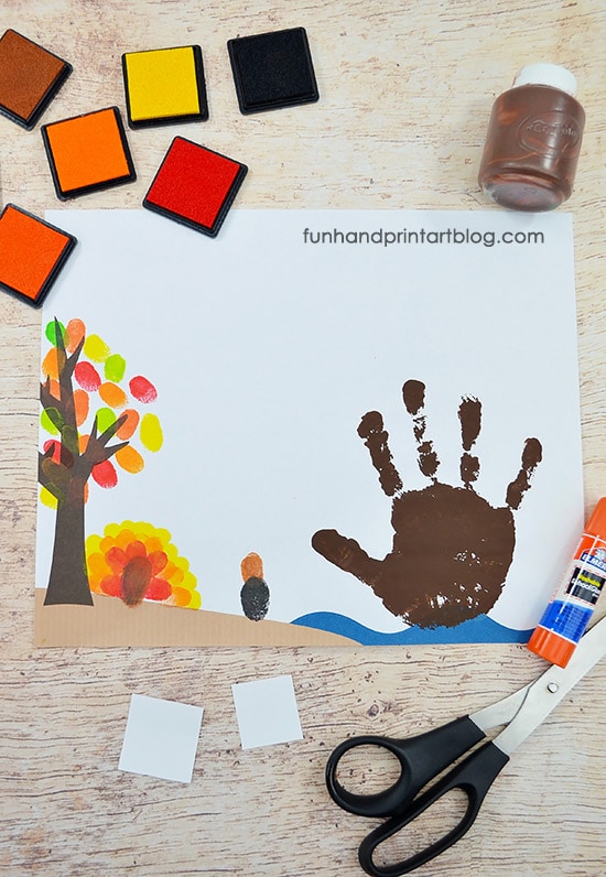Make fingerprints on the printable Thanksgiving background template.