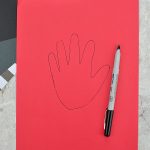 Trace around hand onto construction paper