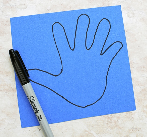 Trace Hand on Blue Paper