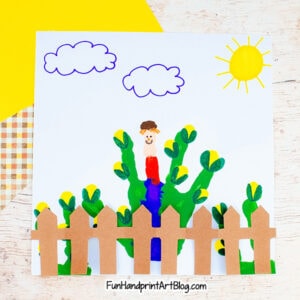 Fall Scarecrow Handprint Craft Idea with folded paper fence